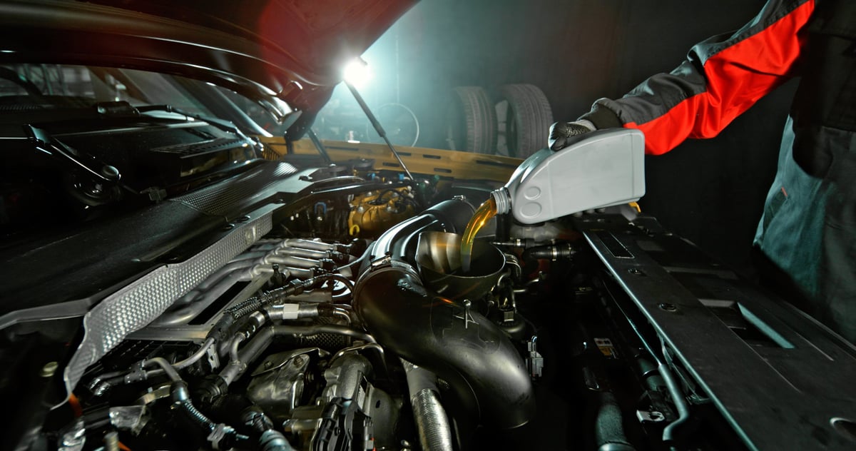 Automotive maintenance, oil change service and professional repair concept with dramatic lighting